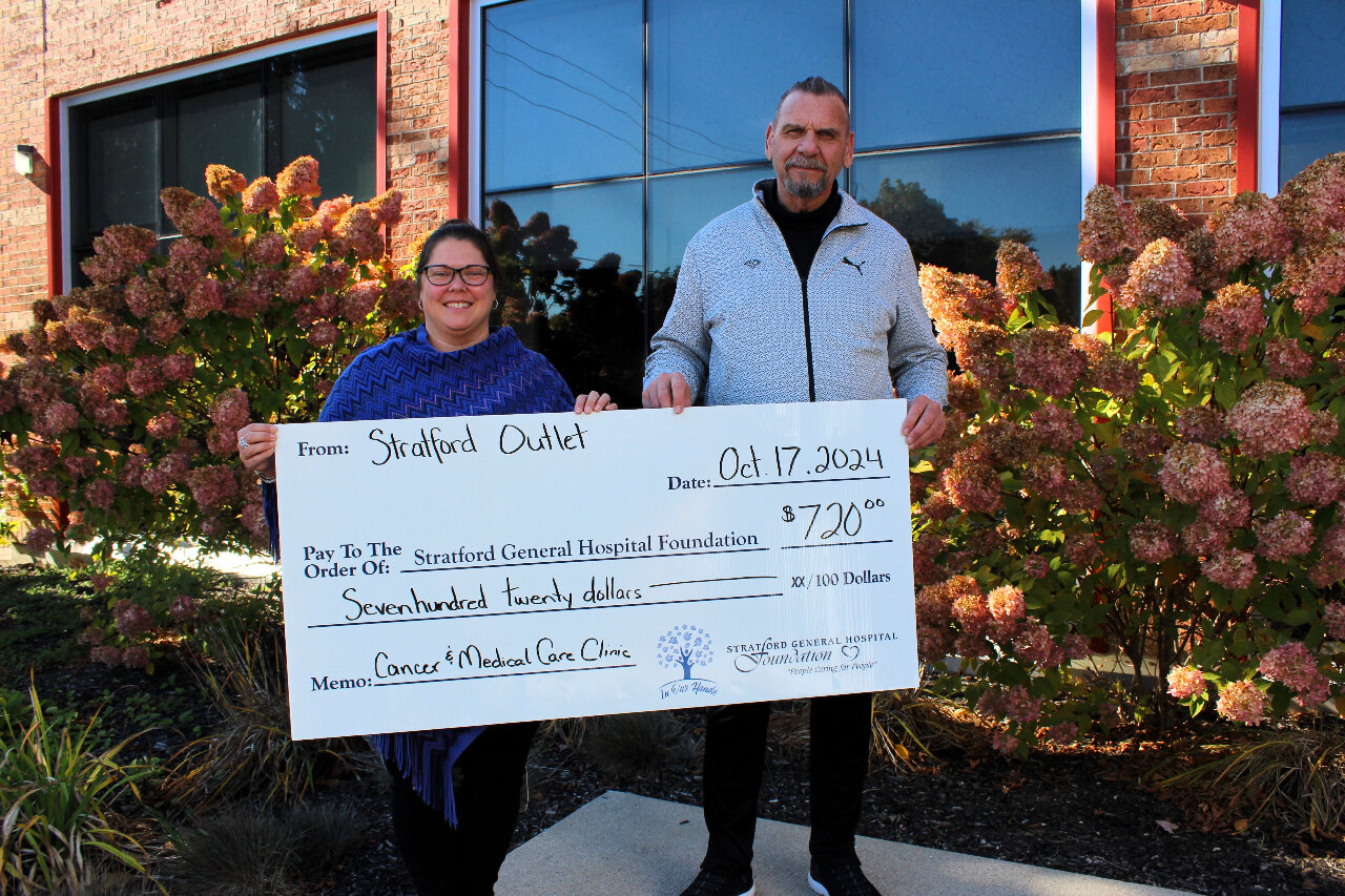 Cheque Presentation with a representative from the Stratford Outlet